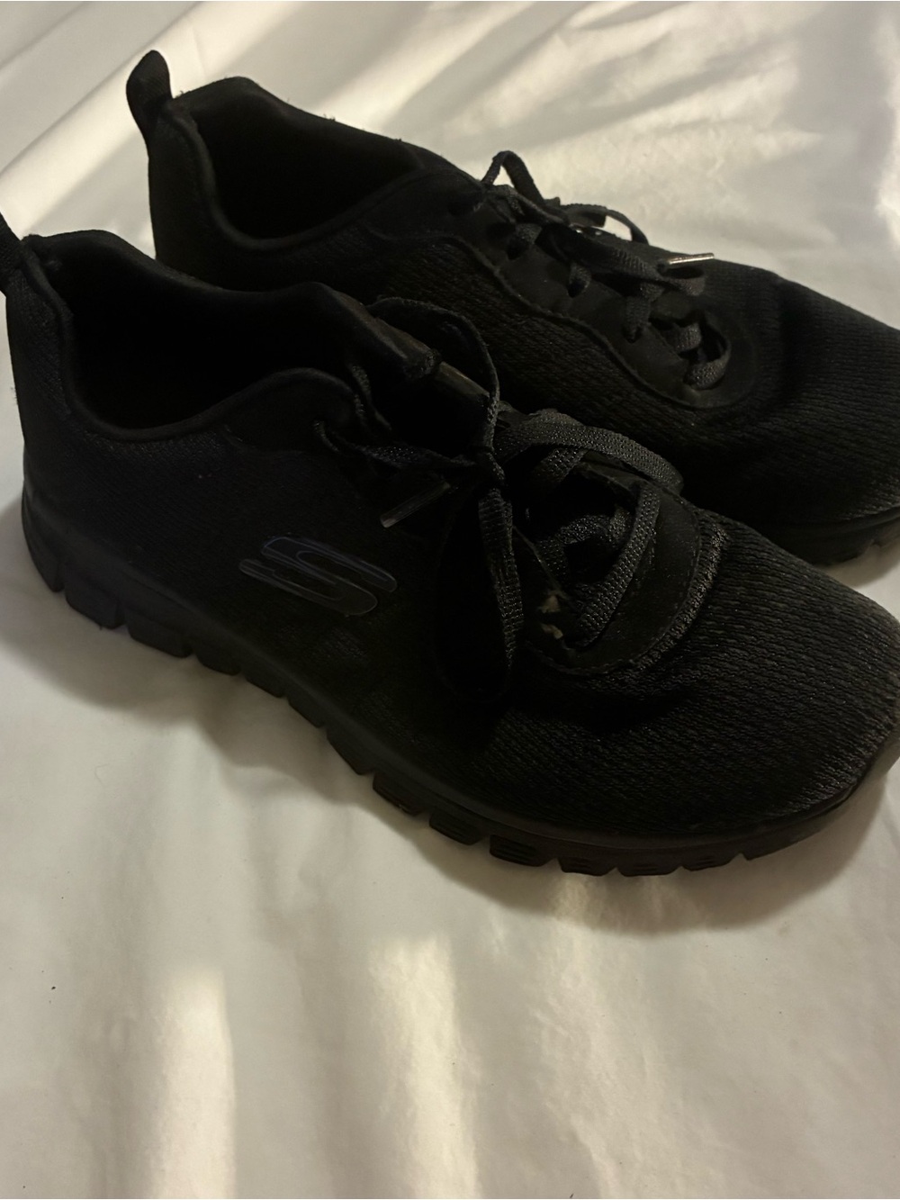 Skechers Woman’s All-Black Slip-On Lace Athletic Sneakers